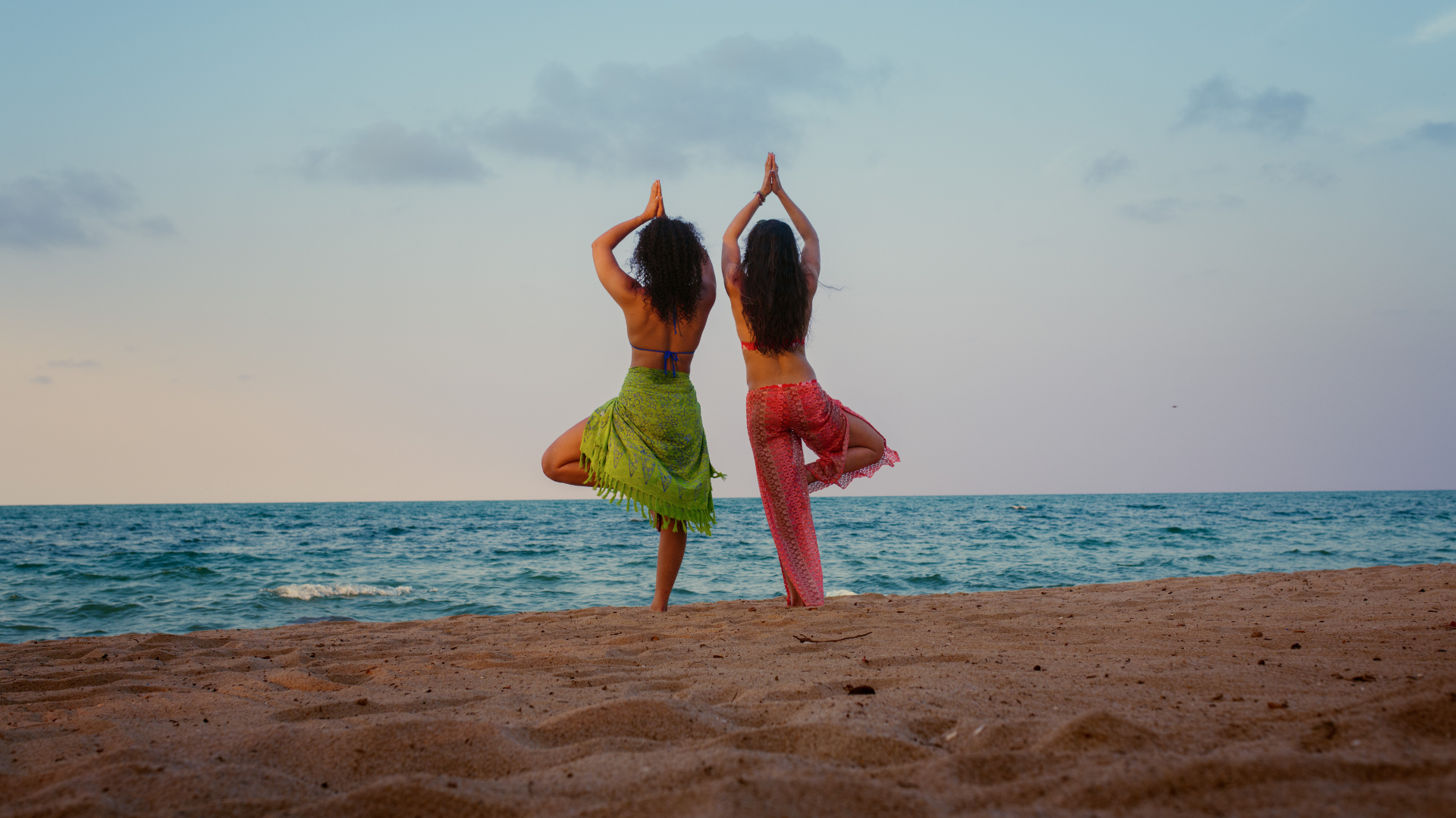 women doing yoga on the beach in Belize
