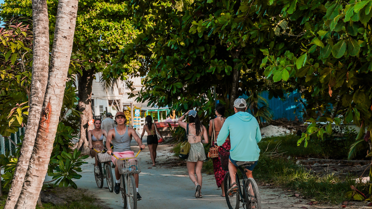 travelers riding bicycles in Caye Caulker, Belize